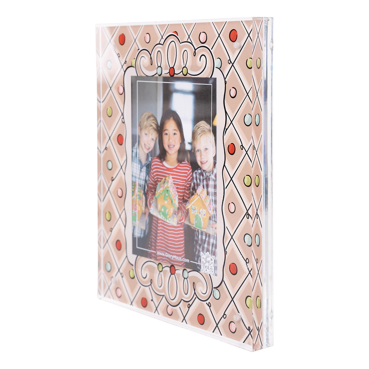 Decorative gingerbread photo frame with a family photo on a white background