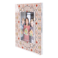 Decorative gingerbread photo frame with a family photo on a white background