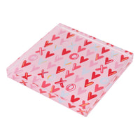 Pink napkin weight with red, pink, and blue heart pattern
