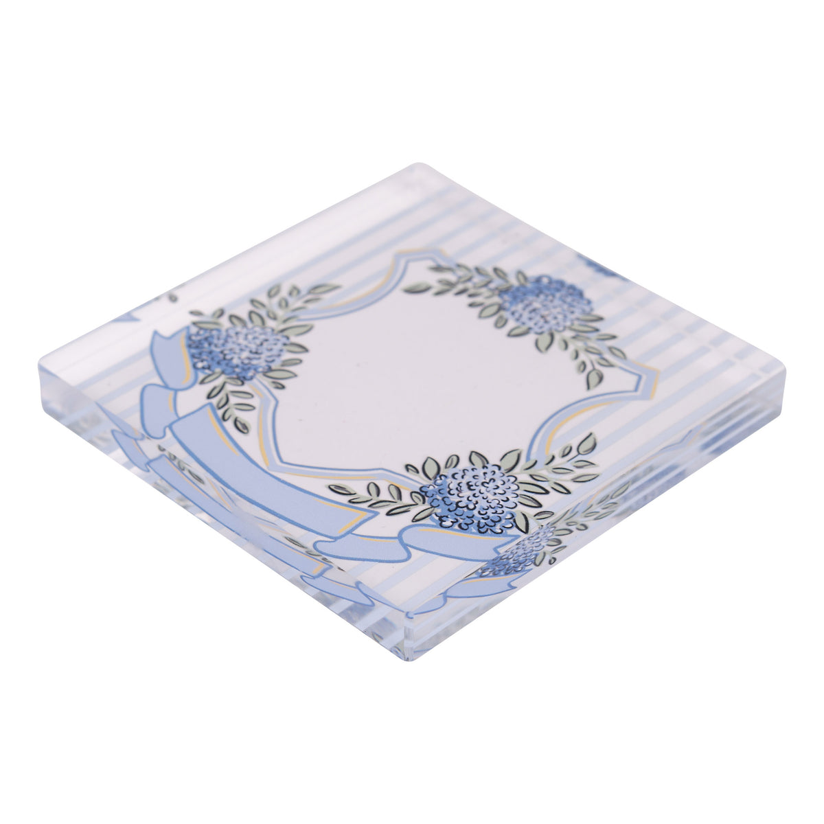 Decorative napkin weight with floral design on a striped background