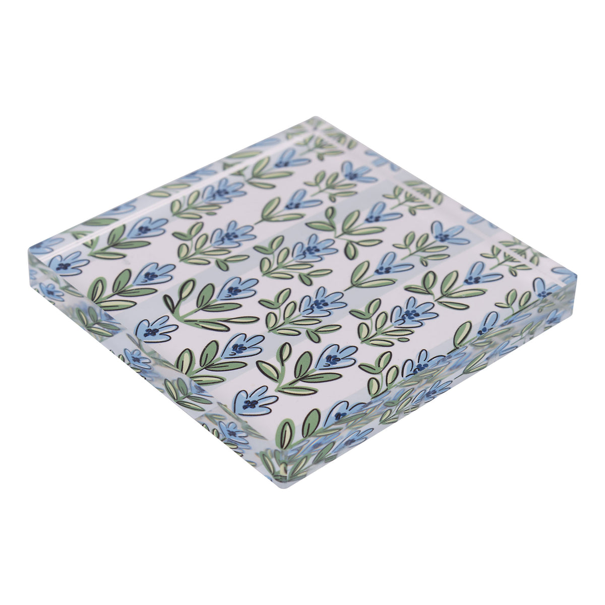 Patterned napkin weight with blue and green floral design on a light 