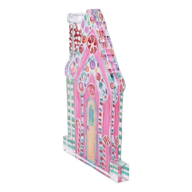 Colorful gingerbread house-shaped acrylic stand on a white background