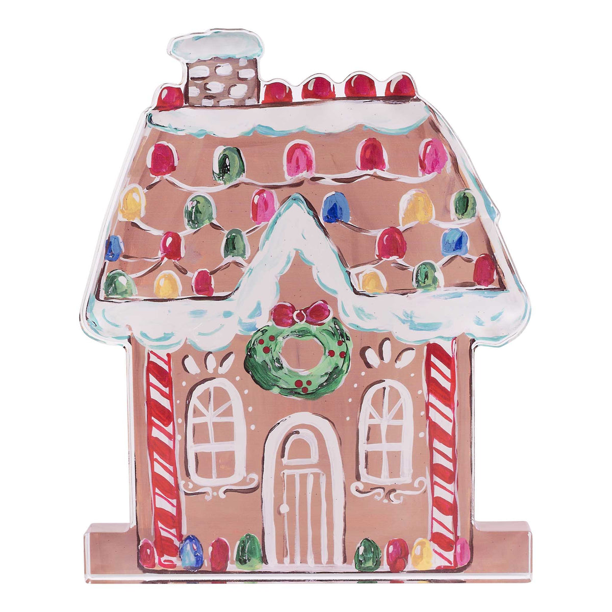 Decorative gingerbread house with colorful roof and candy cane details on a white background