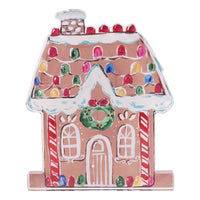 Decorative gingerbread house with colorful roof and candy cane details on a white background