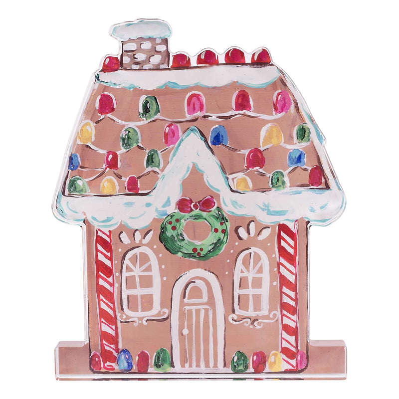 Decorative gingerbread house with colorful roof and candy cane details on a white background