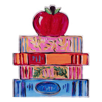 Colorful stack of books with an apple on top against a white background