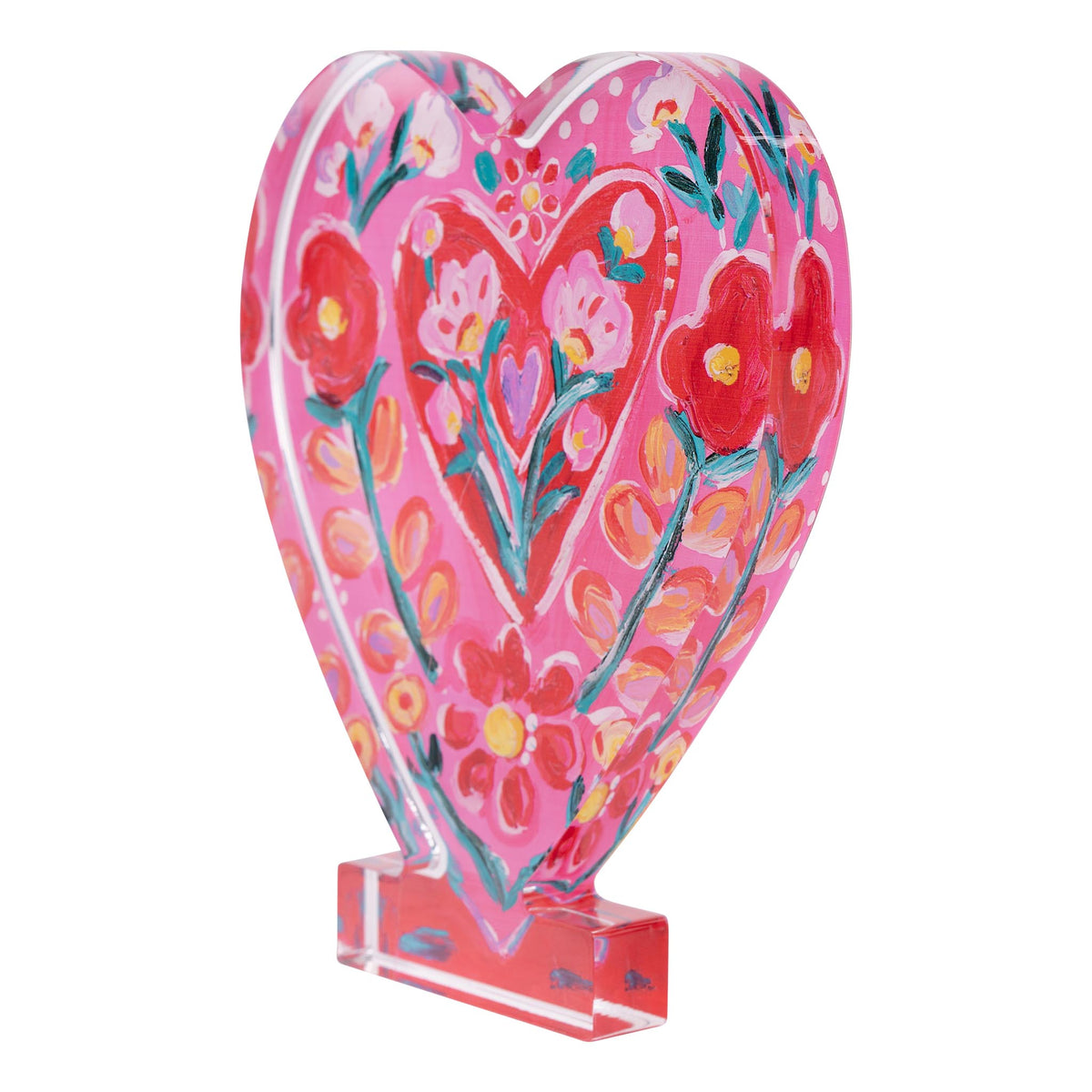 Heart-shaped decorative item with floral design on a white background