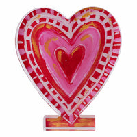 Decorative heart-shaped object with a colorful design on a white background