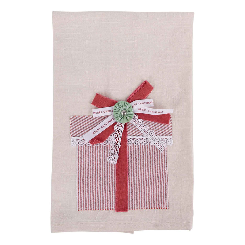 Decorative towel with a red and white striped bow and 'Merry Christmas' tag on a beige background
