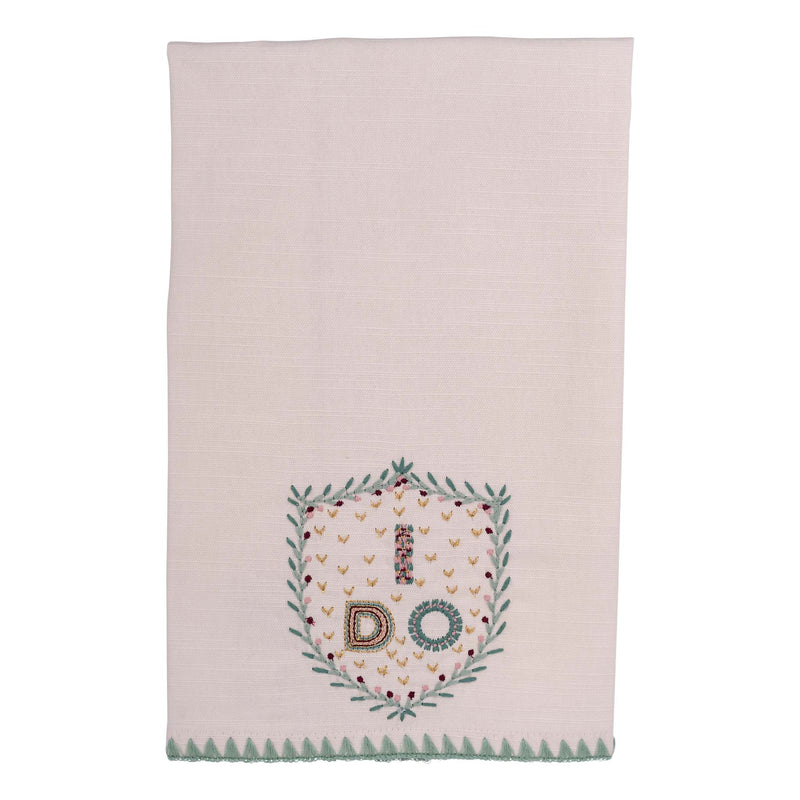 Embroidered towel with 'I DO' design on a light pink background