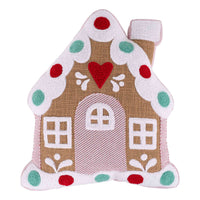 Decorative gingerbread house pillow with a heart on a white background