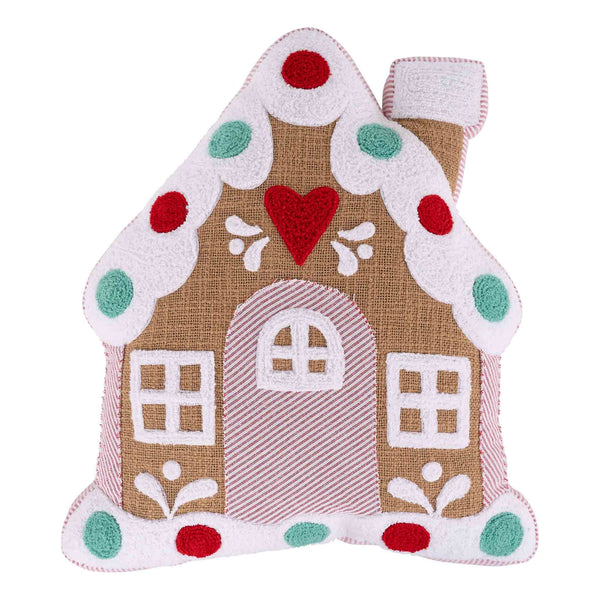Decorative gingerbread house pillow with a heart on a white background