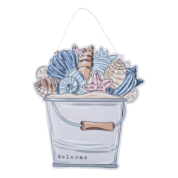 A door hanger featuring a beach bucket filled with seashells, with one side having the text 'Welcome' and the other side 'Tis the Season'.