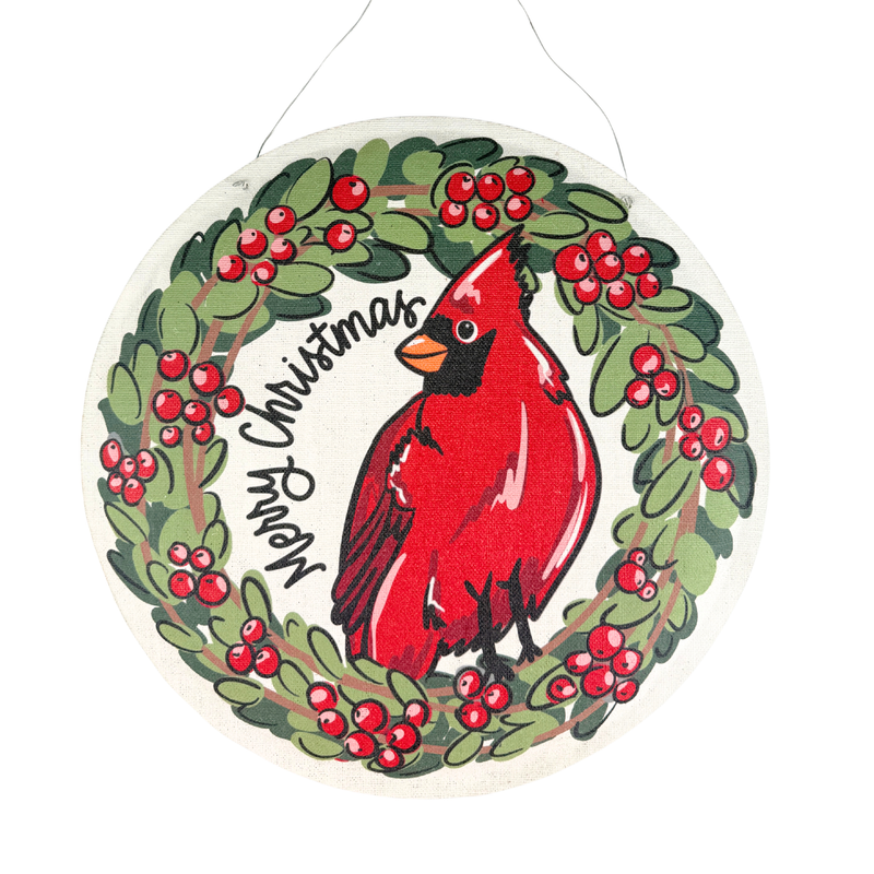 Decorative Christmas ornament with a red cardinal bird and holly wreath.