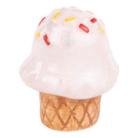 Ice cream cone with pink whipped cream and colorful sprinkles on a white background