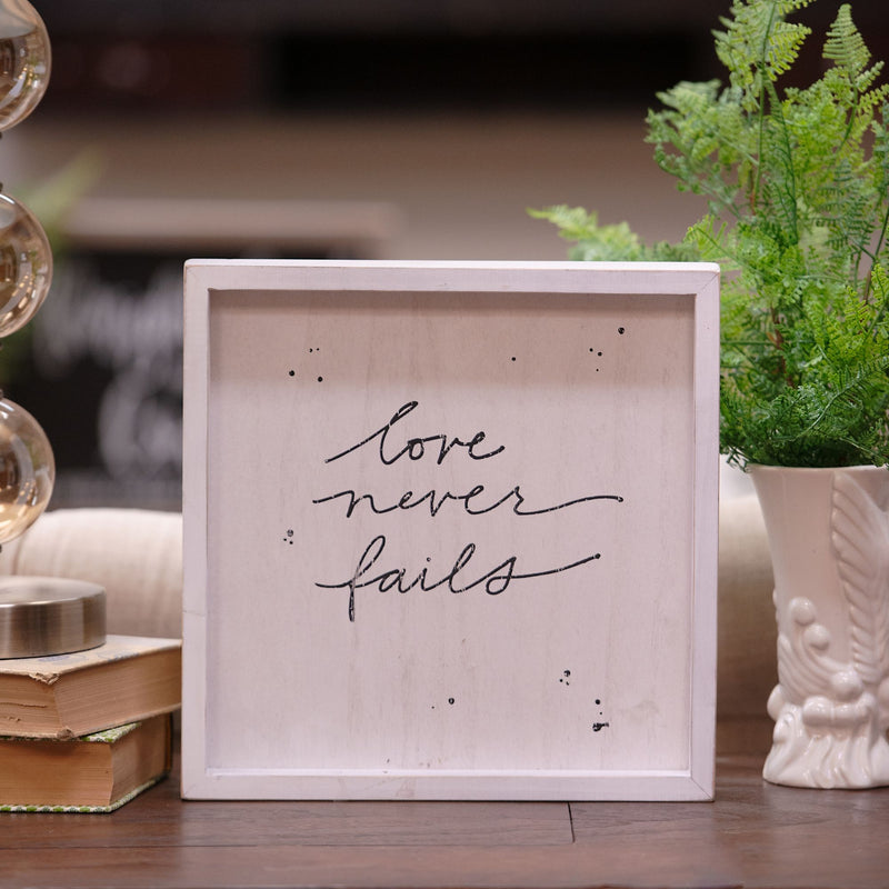 Love Never Fails Framed Board
